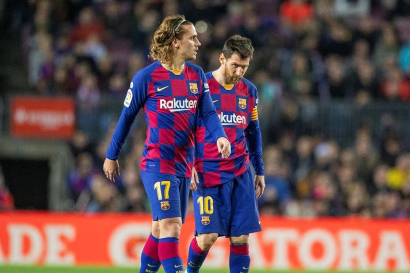 Griezmann (trái) và Messi. Ảnh: Getty.